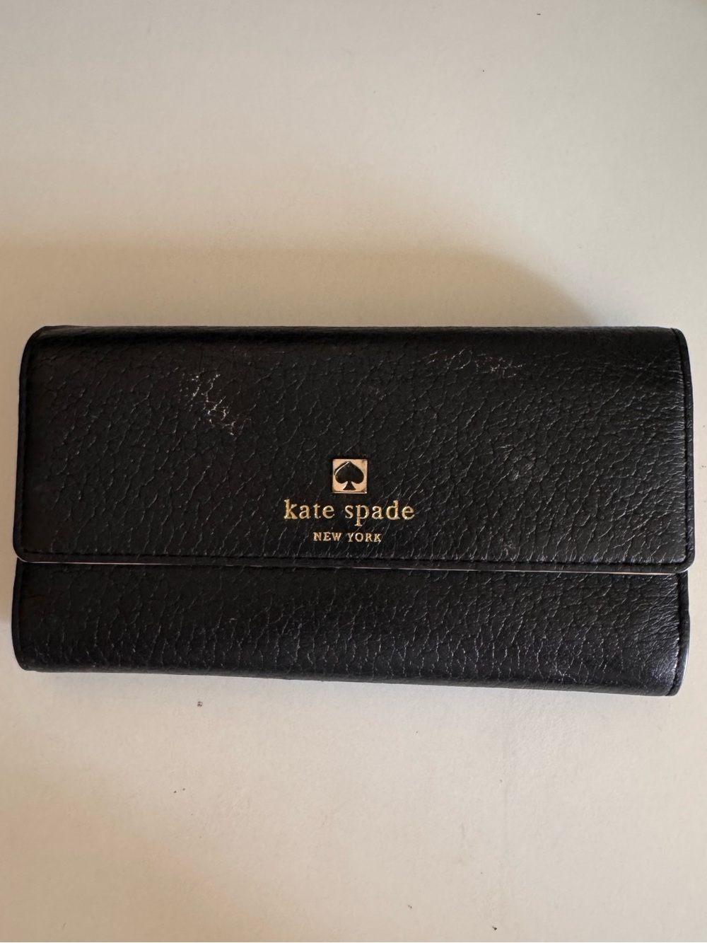 kate spade Black Pebbled Leather Fold Wallet with Gold Logo